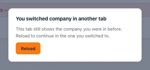The You switched company in another tab message: This tab still shows the company you were in before. Reload to continue in the one you switched to. A Reload button.